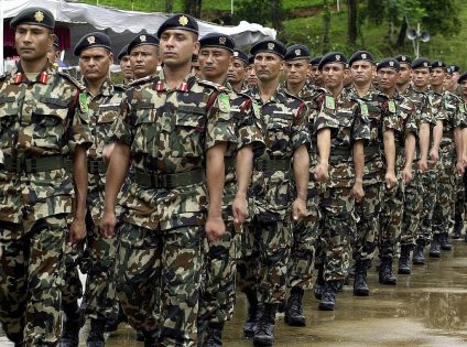 KUKULE, SRI LANKA:  Nepalese troops march past as they take part in a joint drill with security forces from Bangladesh, Mongolia, the US and Sri Lankaat the start of a United Nations Peace Keeping Exercise in the village of Kukule, some 60kms south-east of Colombo, 12 June 2004.  The Multinational Platoon Exercise is aimed at grooming soldiers for United Nations peacekeeping operations with 45 soldiers each from Bangladesh, Mongolia, Nepal and the United States and 70 from Sri Lanka taking part in the two-week exercise.   AFP PHOTO/Sena VIDANAGAMA  (Photo credit should read SENA VIDANAGAMA/AFP via Getty Images)