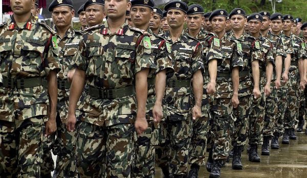 KUKULE, SRI LANKA:  Nepalese troops march past as they take part in a joint drill with security forces from Bangladesh, Mongolia, the US and Sri Lankaat the start of a United Nations Peace Keeping Exercise in the village of Kukule, some 60kms south-east of Colombo, 12 June 2004.  The Multinational Platoon Exercise is aimed at grooming soldiers for United Nations peacekeeping operations with 45 soldiers each from Bangladesh, Mongolia, Nepal and the United States and 70 from Sri Lanka taking part in the two-week exercise.   AFP PHOTO/Sena VIDANAGAMA  (Photo credit should read SENA VIDANAGAMA/AFP via Getty Images)