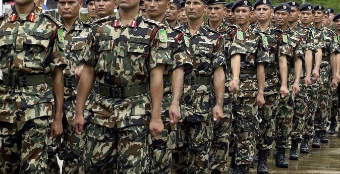 KUKULE, SRI LANKA:  Nepalese troops march past as they take part in a joint drill with security forces from Bangladesh, Mongolia, the US and Sri Lankaat the start of a United Nations Peace Keeping Exercise in the village of Kukule, some 60kms south-east of Colombo, 12 June 2004.  The Multinational Platoon Exercise is aimed at grooming soldiers for United Nations peacekeeping operations with 45 soldiers each from Bangladesh, Mongolia, Nepal and the United States and 70 from Sri Lanka taking part in the two-week exercise.   AFP PHOTO/Sena VIDANAGAMA  (Photo credit should read SENA VIDANAGAMA/AFP via Getty Images)